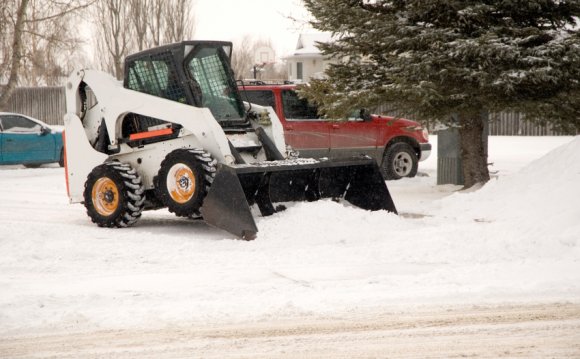 Bob cat removing snow in a