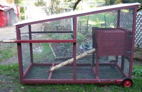 Chicken tractor made with repurposed crate for the nesting area