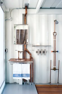 Industrial style bathroom with exposed copper piping
